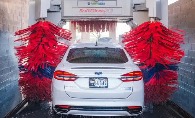 white Ford vehicle on car wash shop